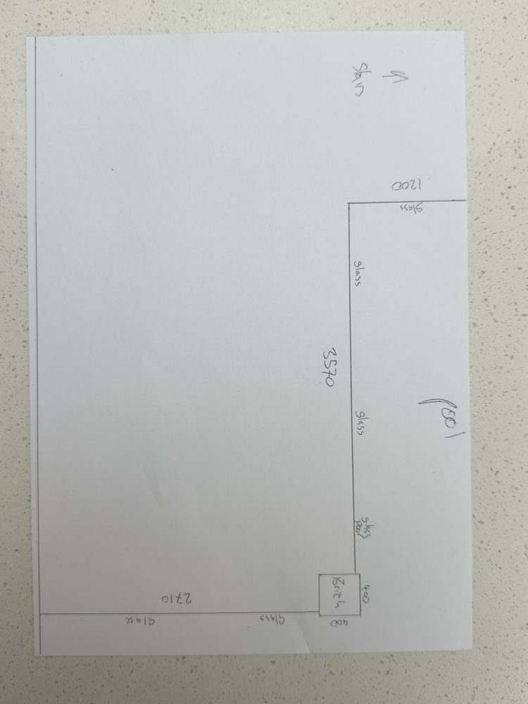 A hand-drawn pool fence sketch on a sheet of paper, with run lengths and the gate marked
